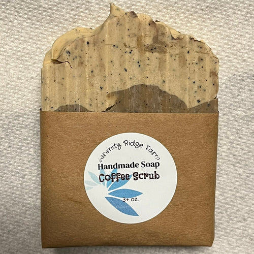 Handmade soap bar with a label on a textured surface