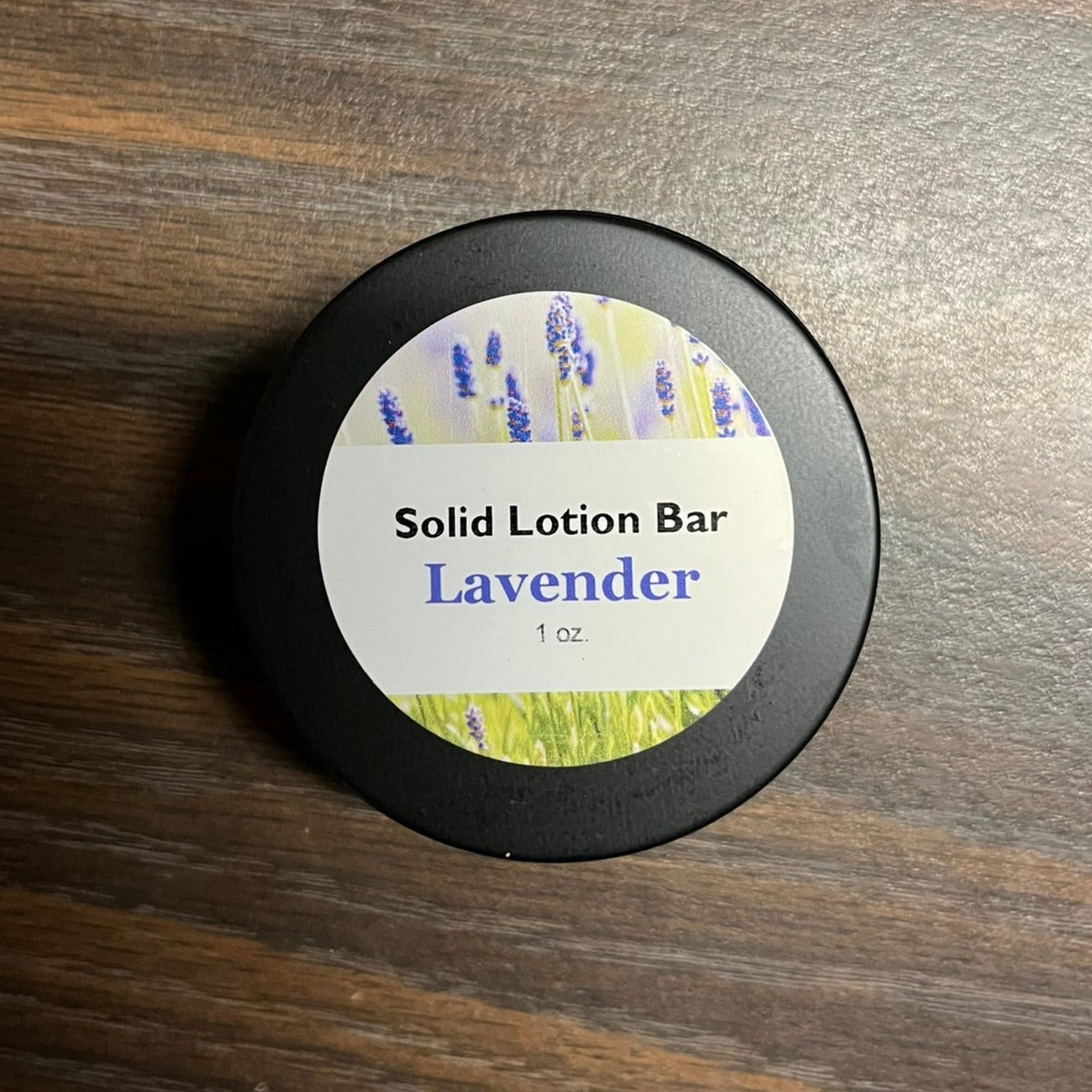 A tin containing lavender lotion bar