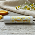 Lip Balm Orange Cream in natural farm setting